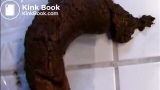 Woman shitting a long hard turd