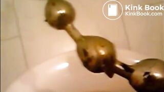 Girl shitting in the toilet and inserting dildo on her asshole