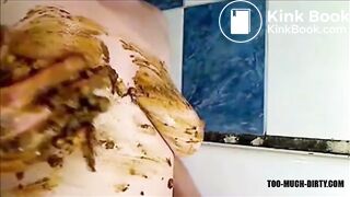 Woman is smearing shit on her breast
