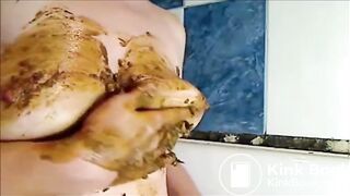 Woman is smearing shit on her breast