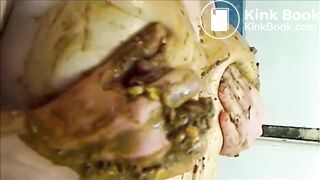 Woman is smearing shit on her breast