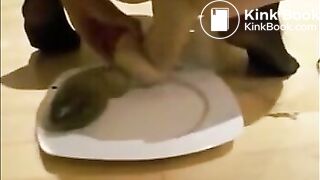 Girl masturbating asshole with dildo while shitting then eating poop