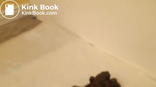Two poops over edge of bath