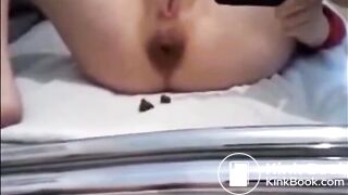 Girl shitting while recording herself with the phone
