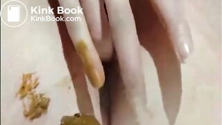 Shaved girl shitting closeup and fingering her pussy