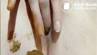 Shaved girl shitting closeup and fingering her pussy