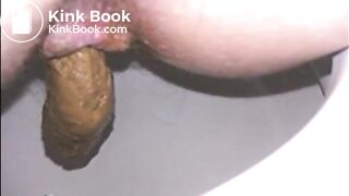 Woman shitting long turd in the toilet