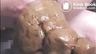 Girl shitting a very big turd closeup