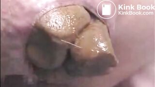 Girl shitting a very big turd closeup