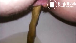 Hairy milf shitting in the toilet