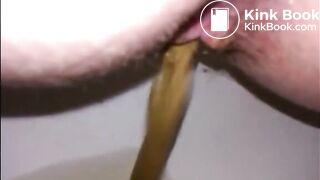 Hairy milf shitting in the toilet