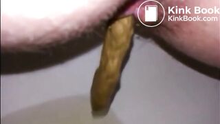 Hairy milf shitting in the toilet