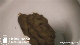 Girl shitting in the toilet closeup