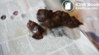 Slim brunette pushes out a meaty turd