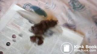 Slim brunette pushes out a meaty turd