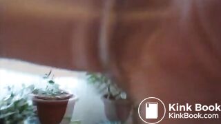 Slim brunette pushes out a meaty turd