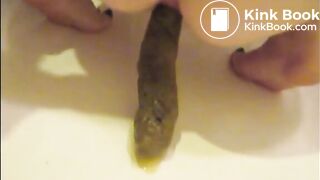Mature woman shitting an hard turd closeup