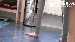 Girl open wide legs and shitting on the toilet floor