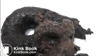 Very sexy brunette in high heels and lingerie shitting a black turd