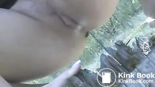 Beautiful blonde poops on a tree stump