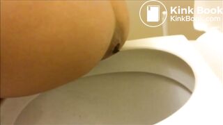 Woman in black pooping