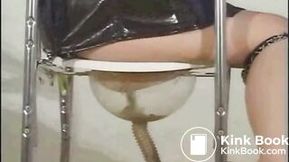 Slave gets fed a shitty enema expulsion through a special toilet bowl