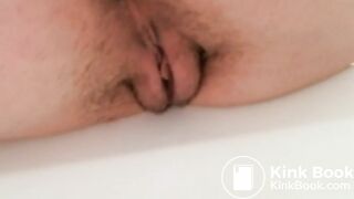 Bathtub closeup poop