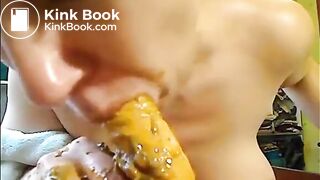 Girl doing a blowjob to a dildo full of shit