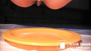 Babe shitting hard turd on a plate