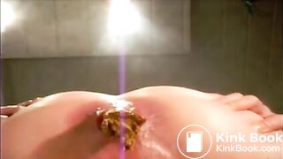 Girl with black tanga masturbating and shitting an hard turd