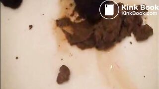 Babe shitting in the bathroom and put her nylon feet on it