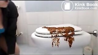 Brunette shitting on the cover of toilet then put her face on it