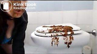 Brunette shitting on the cover of toilet then put her face on it