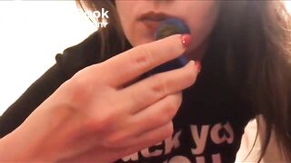 Using her buttplug to apply lipstick