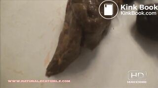 Tegan drops a big solid poop on the bathroom floor