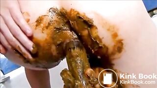 Girl shitting and masturbating with shitty dildo