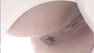 Girl shitting a lot in the toilet closeup