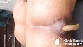 Hairy woman shitting doggystyle closeup