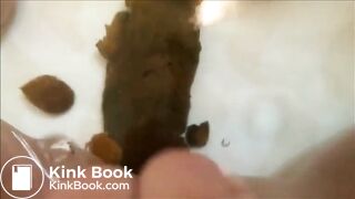 Woman shitting big turd in the water