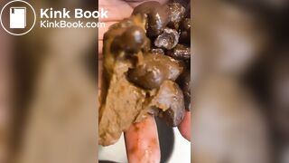 Ebony lady pushing pebbles into the toilet