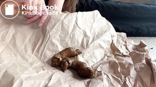 A nice solid poop on brown wrapping paper