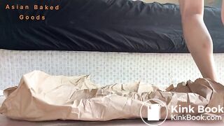 A nice solid poop on brown wrapping paper