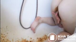 Young girl shitting a very liquid diarrhea in the bathtub -