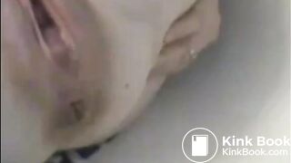 After enema woman shitting with power a lot in the bathtub