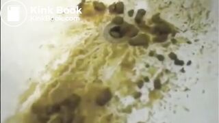 After enema woman shitting with power a lot in the bathtub
