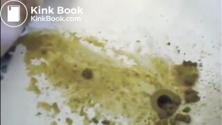 After enema woman shitting with power a lot in the bathtub