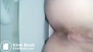 Girl shitting a dark turd in the toilet closeup