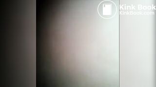 Girl shitting a dark turd in the toilet closeup