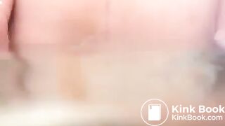 Woman shitting long diarrhea in the bathtub water