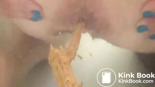 Woman shitting long diarrhea in the bathtub water
